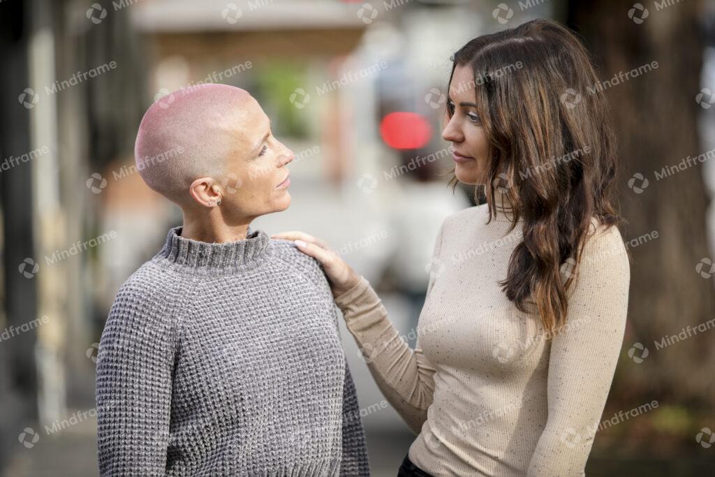 two-people-standing-and-hand-on-shoulder-mindframe-online-image