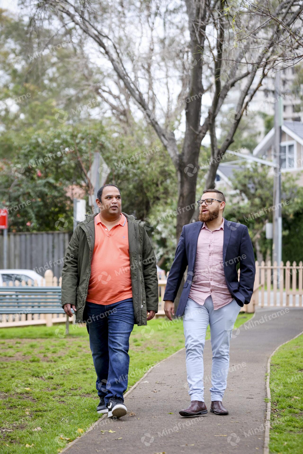 Two People Talking And Walking Outside In Park Mindframe Online Image two-people-talking-and-walking-outside-in-park-mindframe-online-image