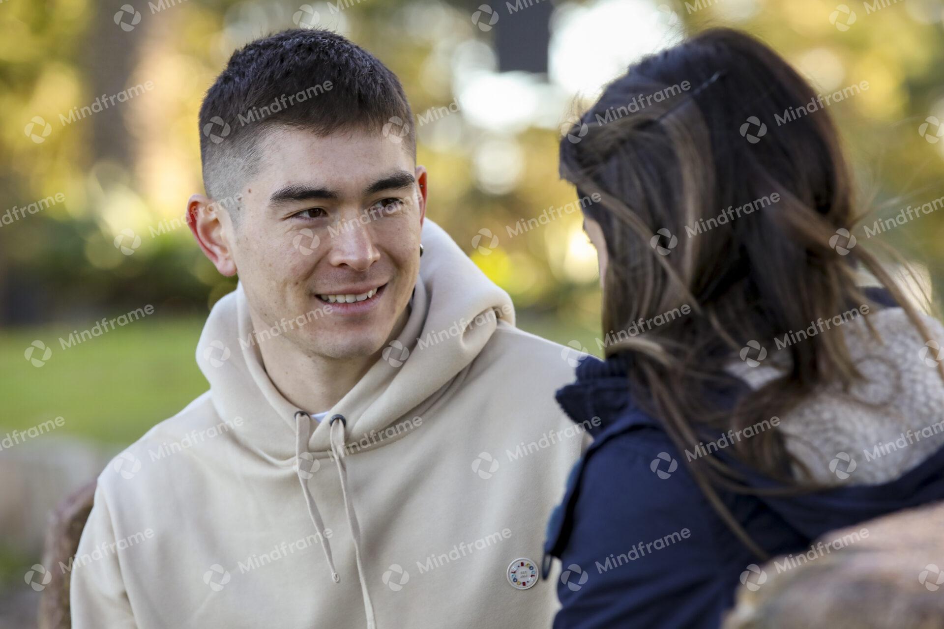 Two People Talking And Sitting In Park Talking Mindframe Online Image two-people-talking-and-sitting-in-park-talking-mindframe-online-image