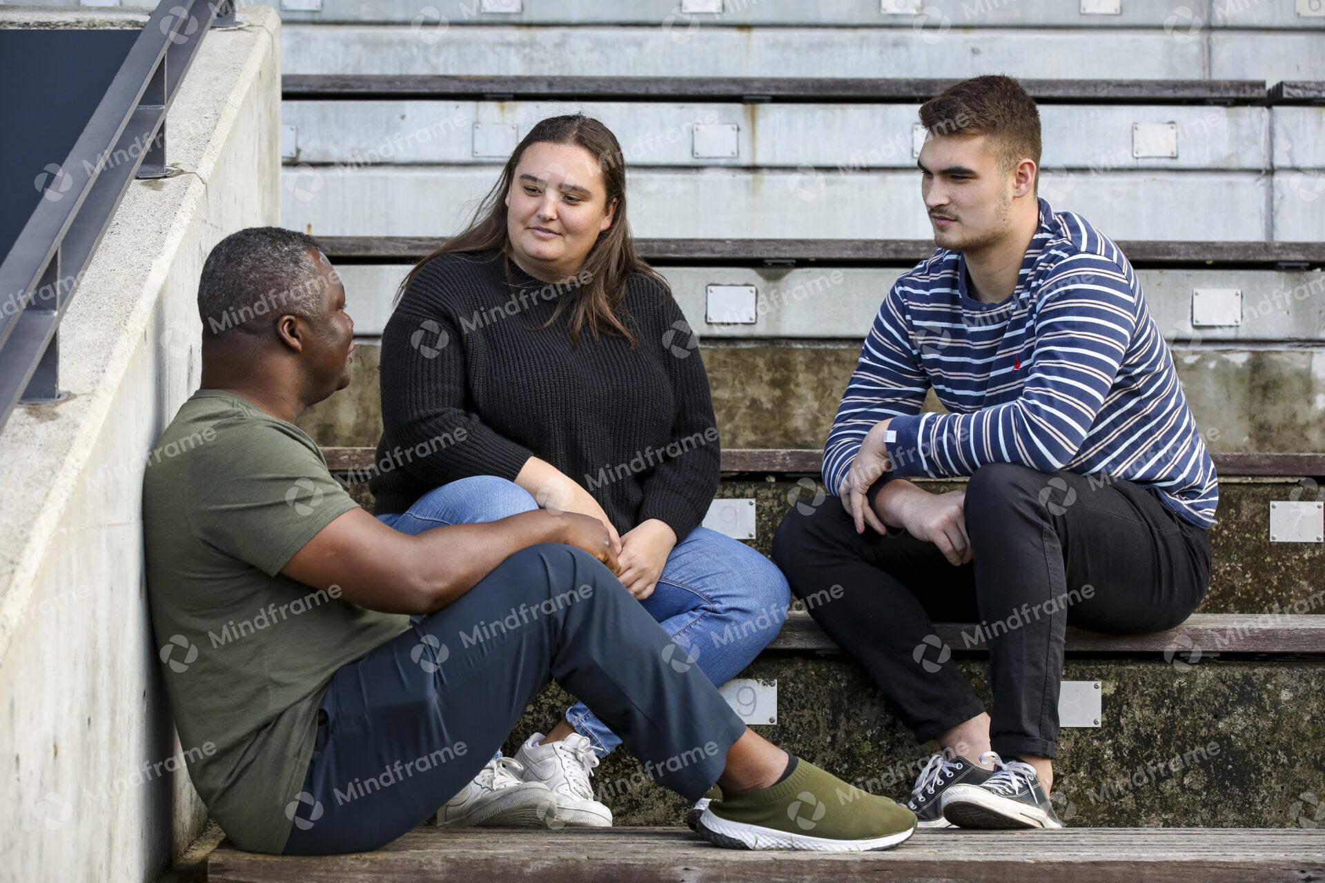Three People Talking Sitting On Step Outside Mindframe Online Image three-people-talking-sitting-on-step-outside-mindframe-online-image