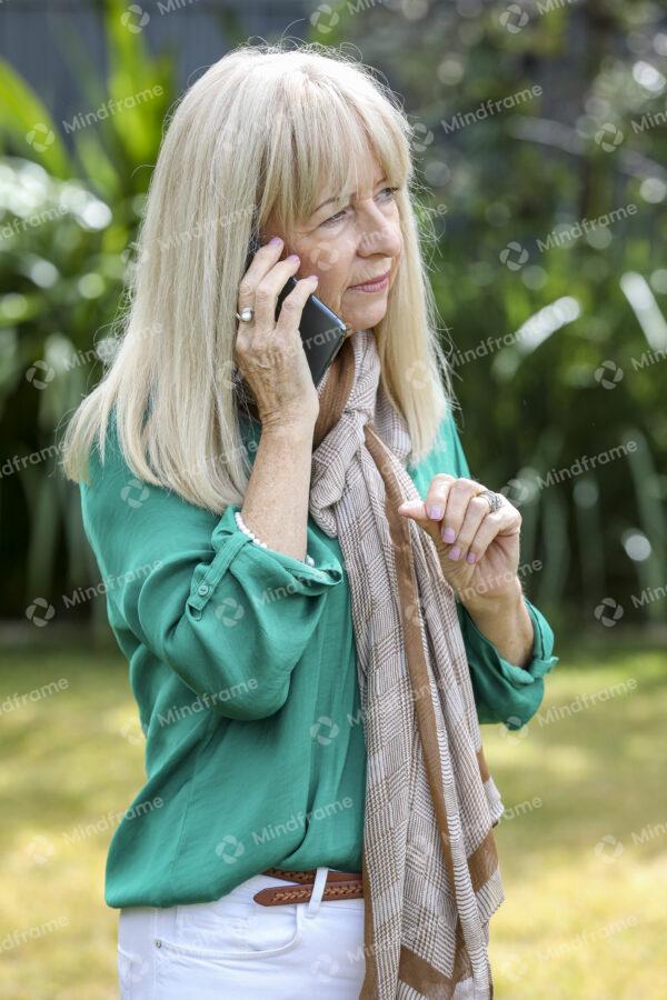 One person in the garden, on their phone