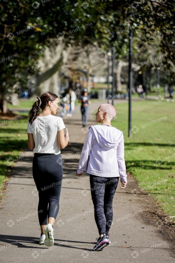 Two people walking and talking