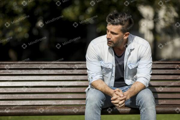 One person sitting alone on a bench