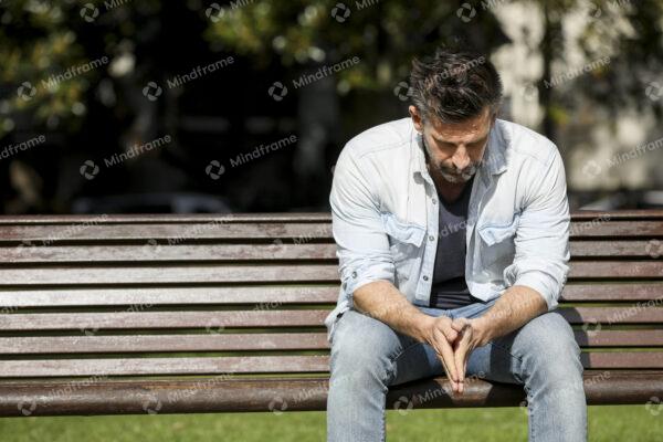 One person sitting alone on a bench