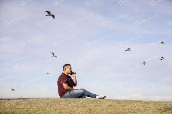 One person using mobile phone on the grass